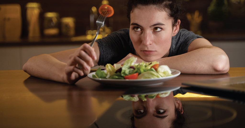 woman frustrated over eating healthy but not losing weight